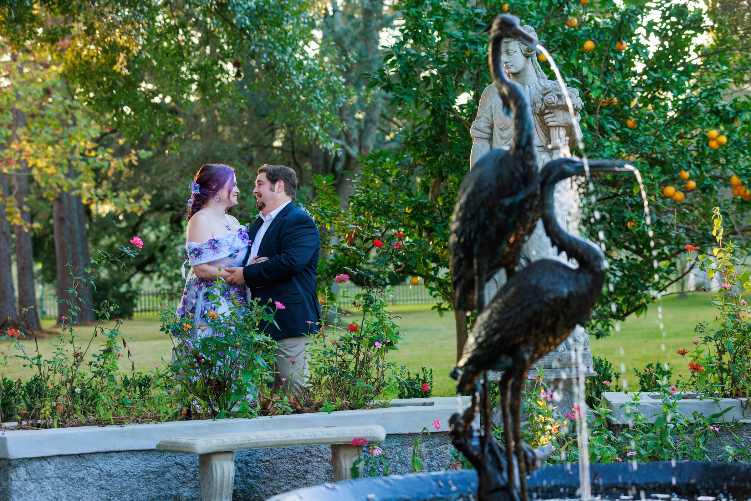 Couple kiss under sparklers at reception